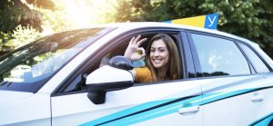 car-driving-student-showing-okay-gesture-sign-and-sitting-at-vehicle-driver-position-1